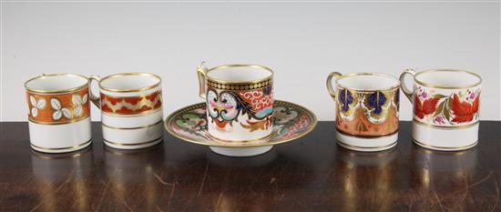 Five Worcester gilt and polychrome porcelain coffee cans and a saucer, c.1800-1820, coffee can 6.3cm, saucer 14.7cm